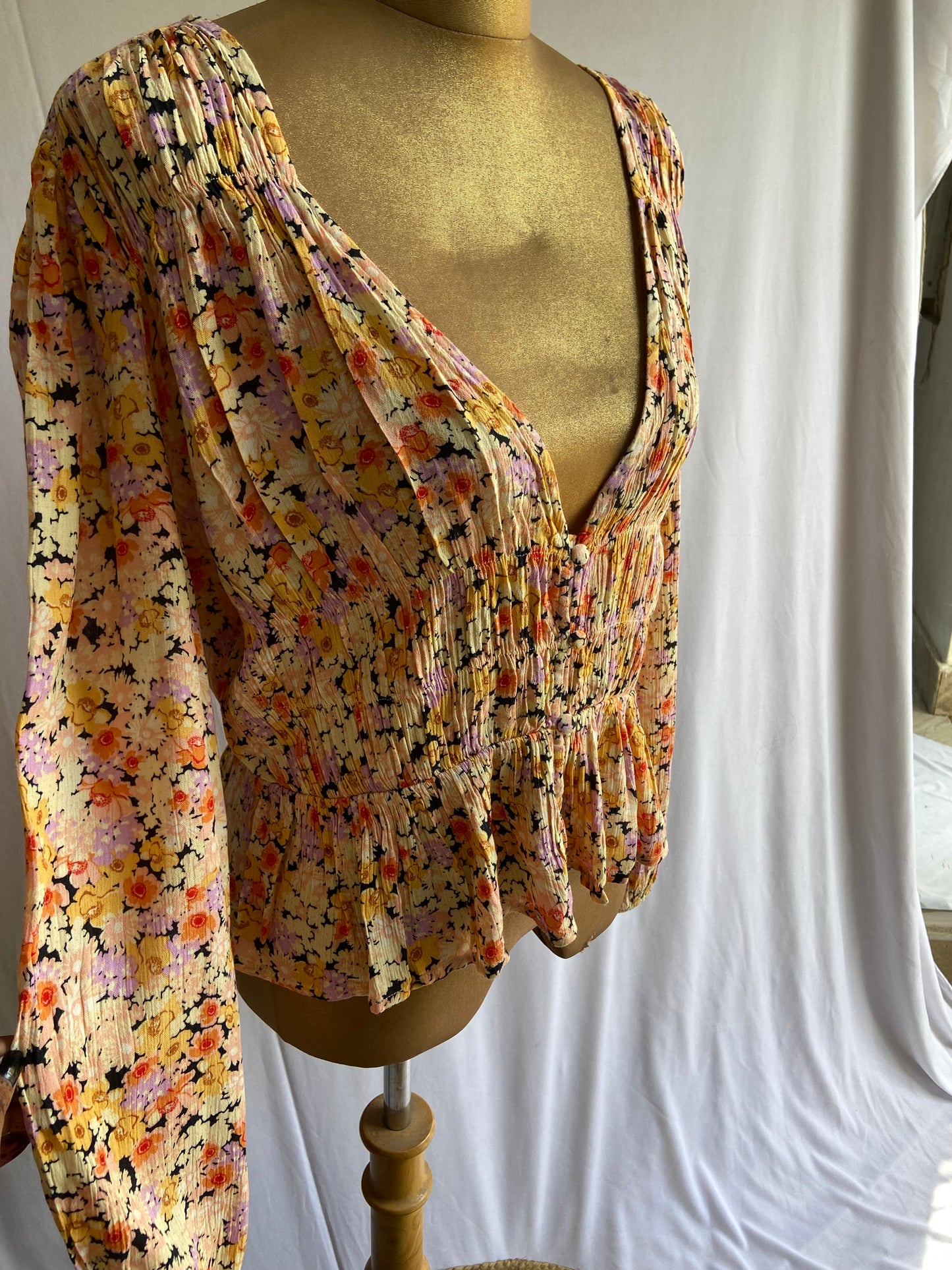 Floral Smocked Peplum Blouse with Deep V-Neck