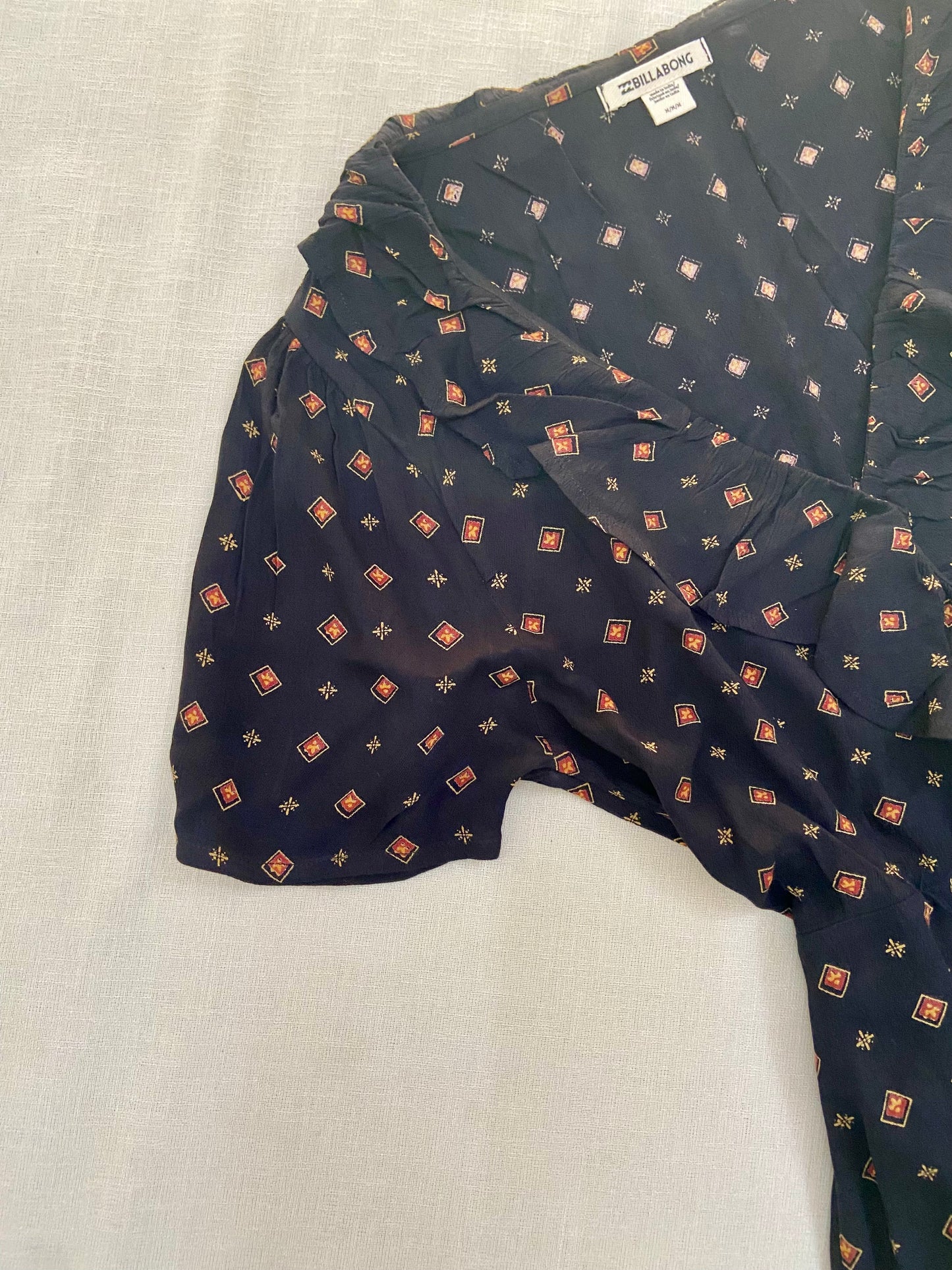 Vintage-Inspired Wrap Mini Dress with Geometric Print