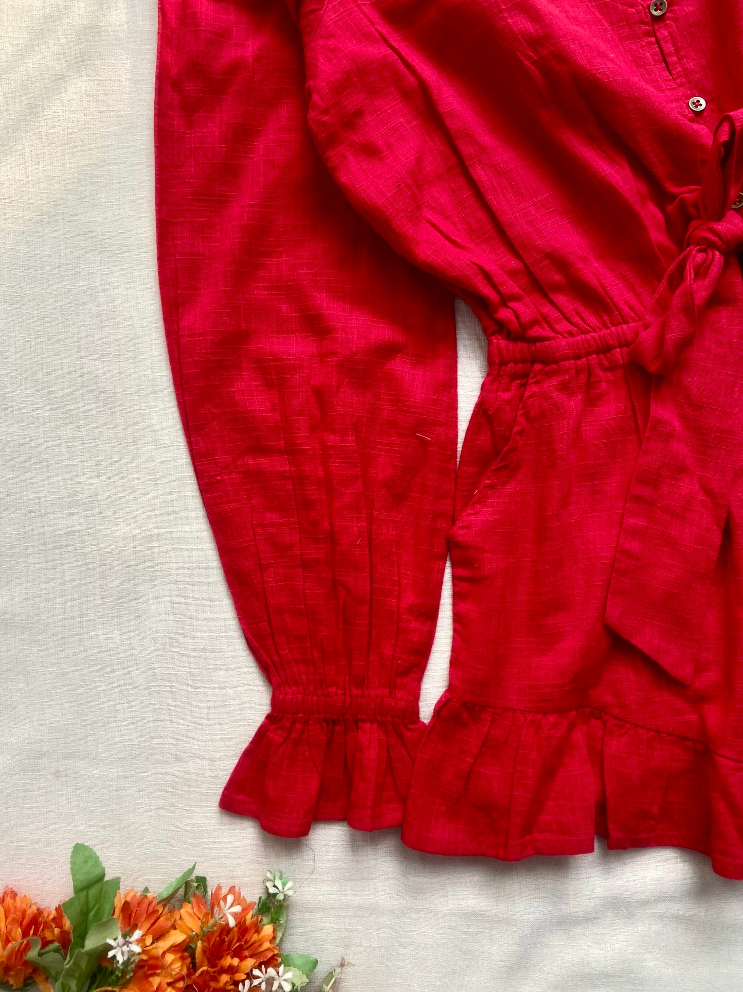 Women’s Red Ruffle Hem Romper with Long Sleeves