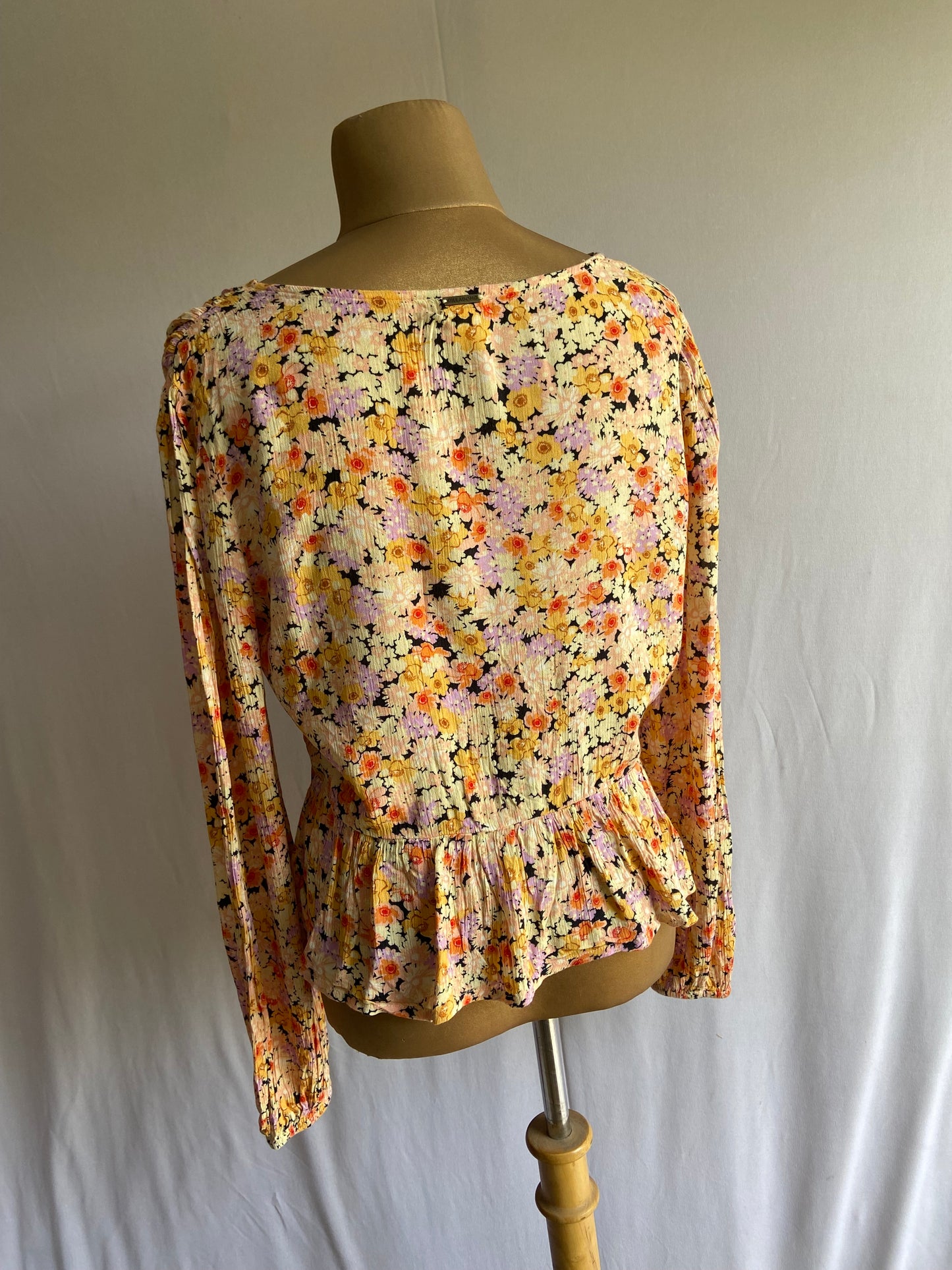 Floral Smocked Peplum Blouse with Deep V-Neck