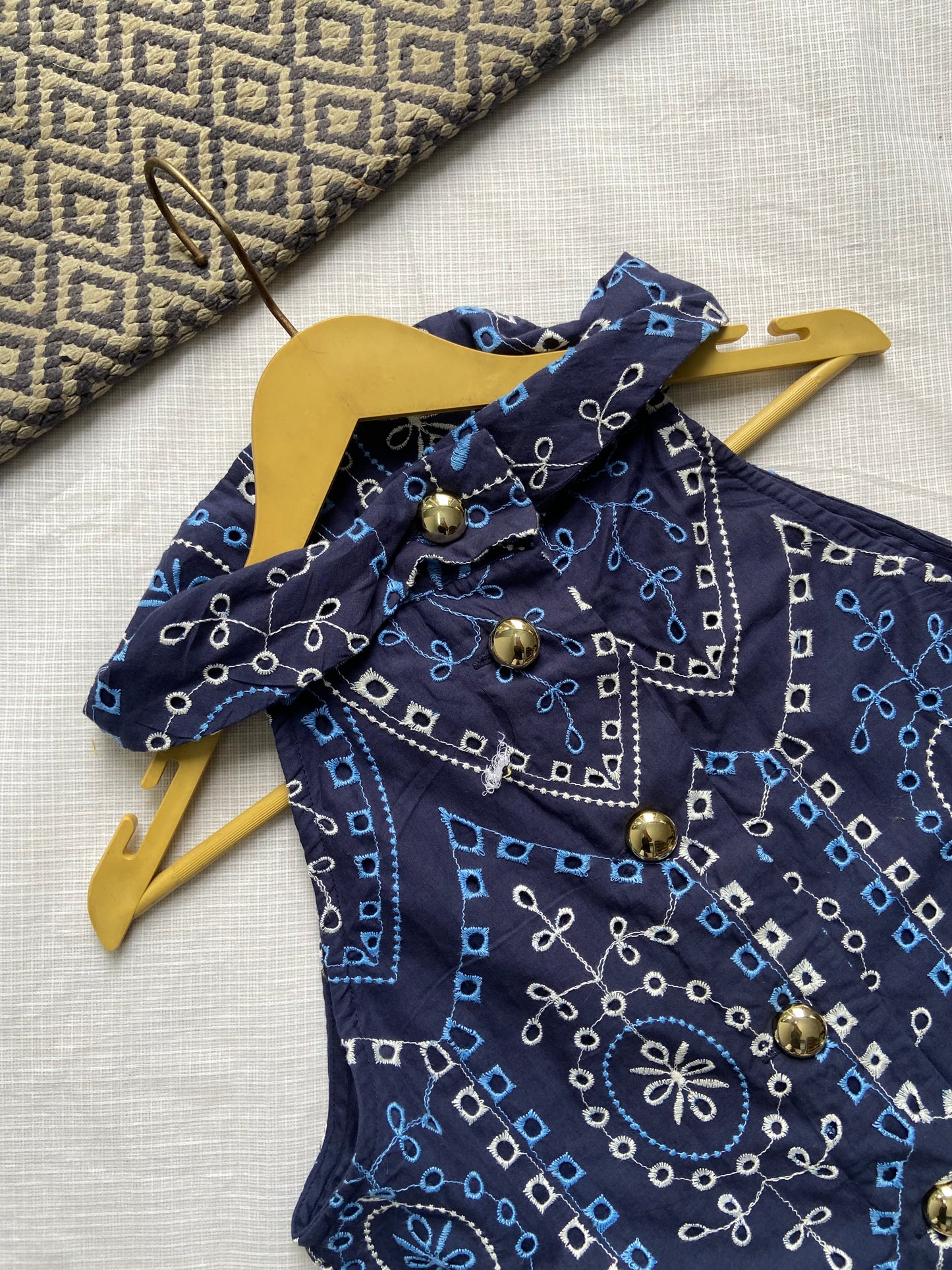 Elegant Blue Embroidered Sleeveless Top with Gold Buttons